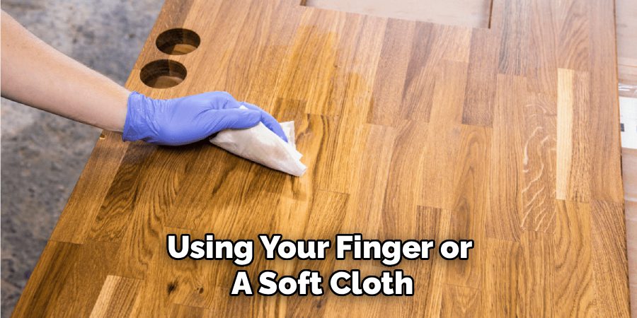 Using Your Finger or
A Soft Cloth